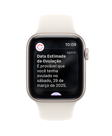 Apple Watch SE 3 com caixa estelar de alumínio e pulseira esportiva estelar, notificação de estimativa da data de ovulação do app Acompanhamento de Ciclo no app Saúde, Digital Crown no lado direito