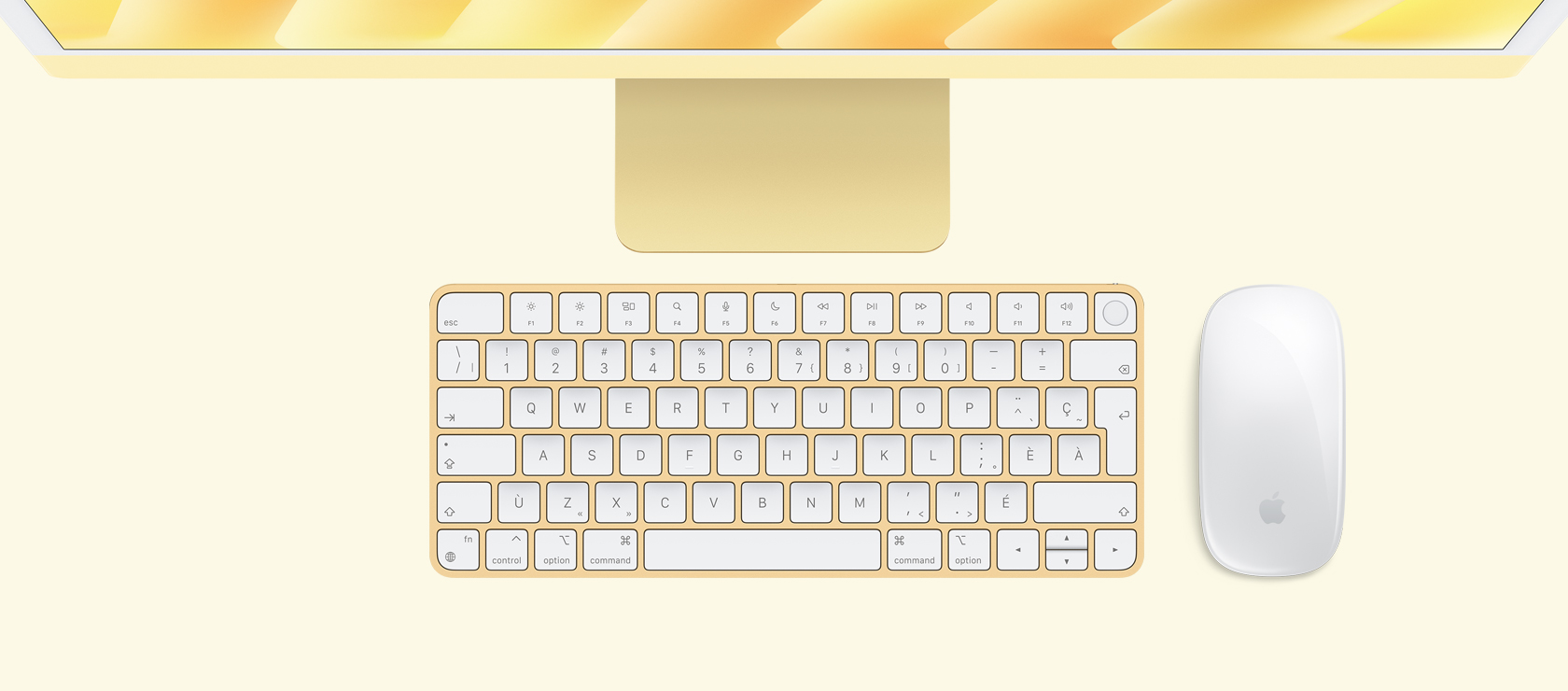 iMac jaune vu de haut, avec souris et clavier assortis.