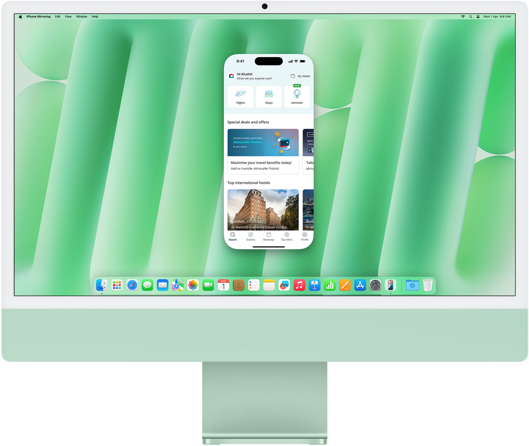 iPhone Mirroring feature demonstration. iPhone screen displaying Uber Eats app mirrored and controlled on iMac.