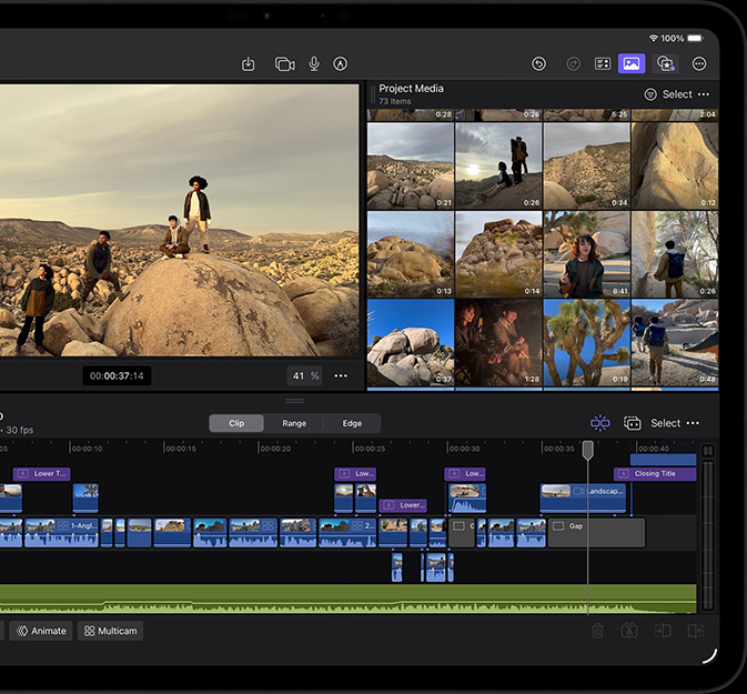 iPad Pro, front exterior, landscape orientation, space black, displaying Final Cut Pro interface with a desert adventure project open, photo of four people in desert landscape with multiple video clips and timeline