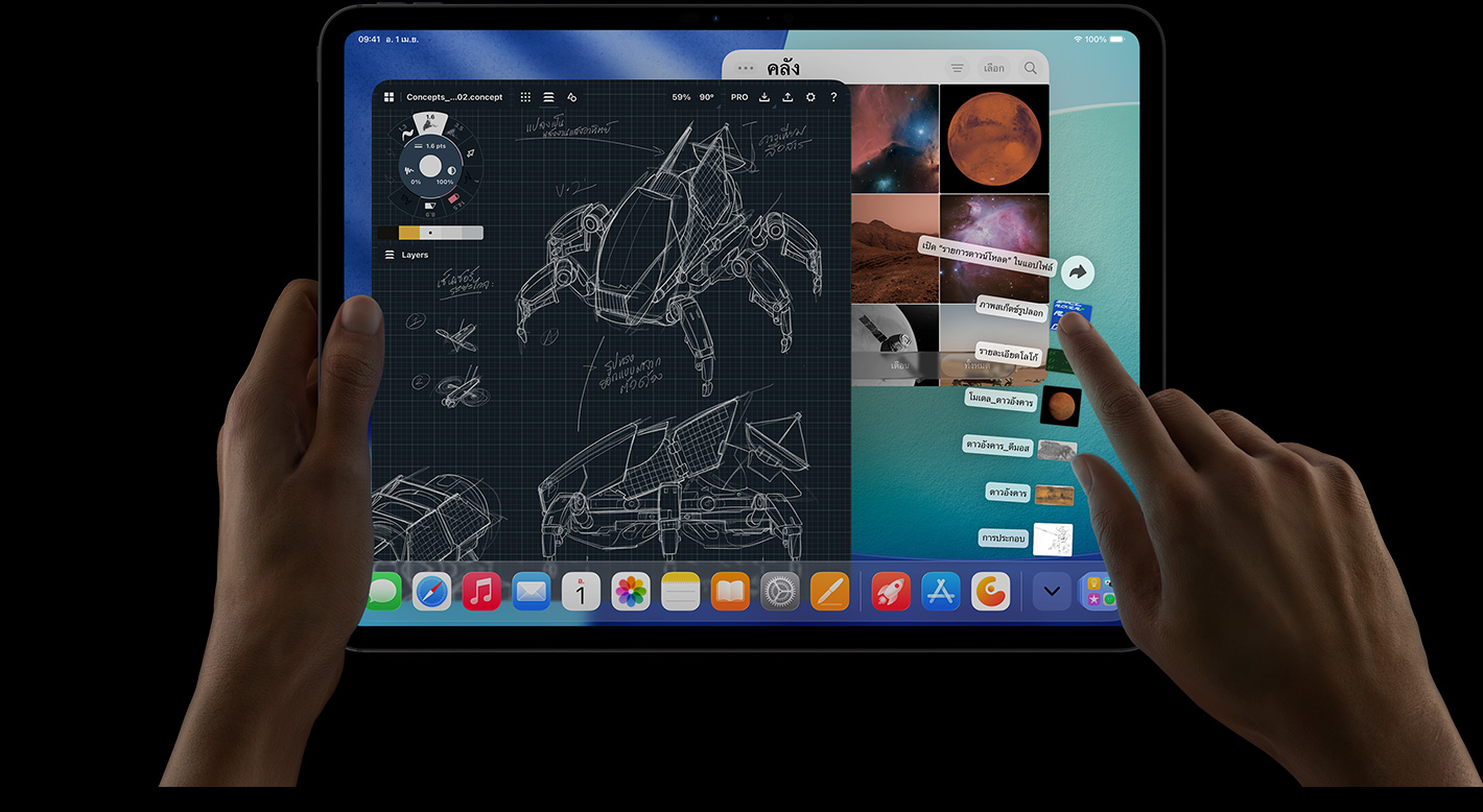 iPad Pro, front exterior, landscape orientation, right hand gesturing over Downloads folder files fanned out, display showing iPadOS 26 interface with multiple open apps including photo editing app with detailed robot blueprints and handwritten annotations and multiple design stages, and Photos Library