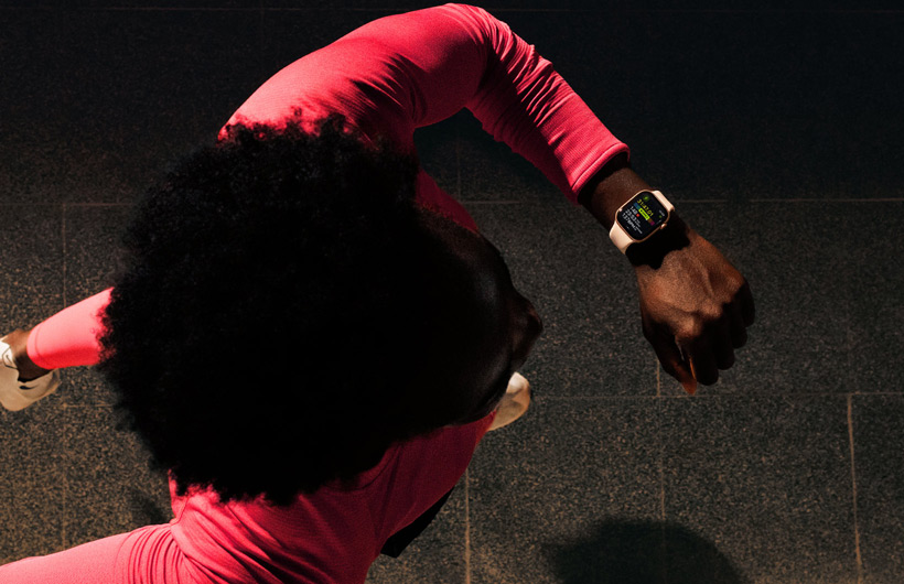 A person checks progress on Apple Watch Series 11 Workout app while running