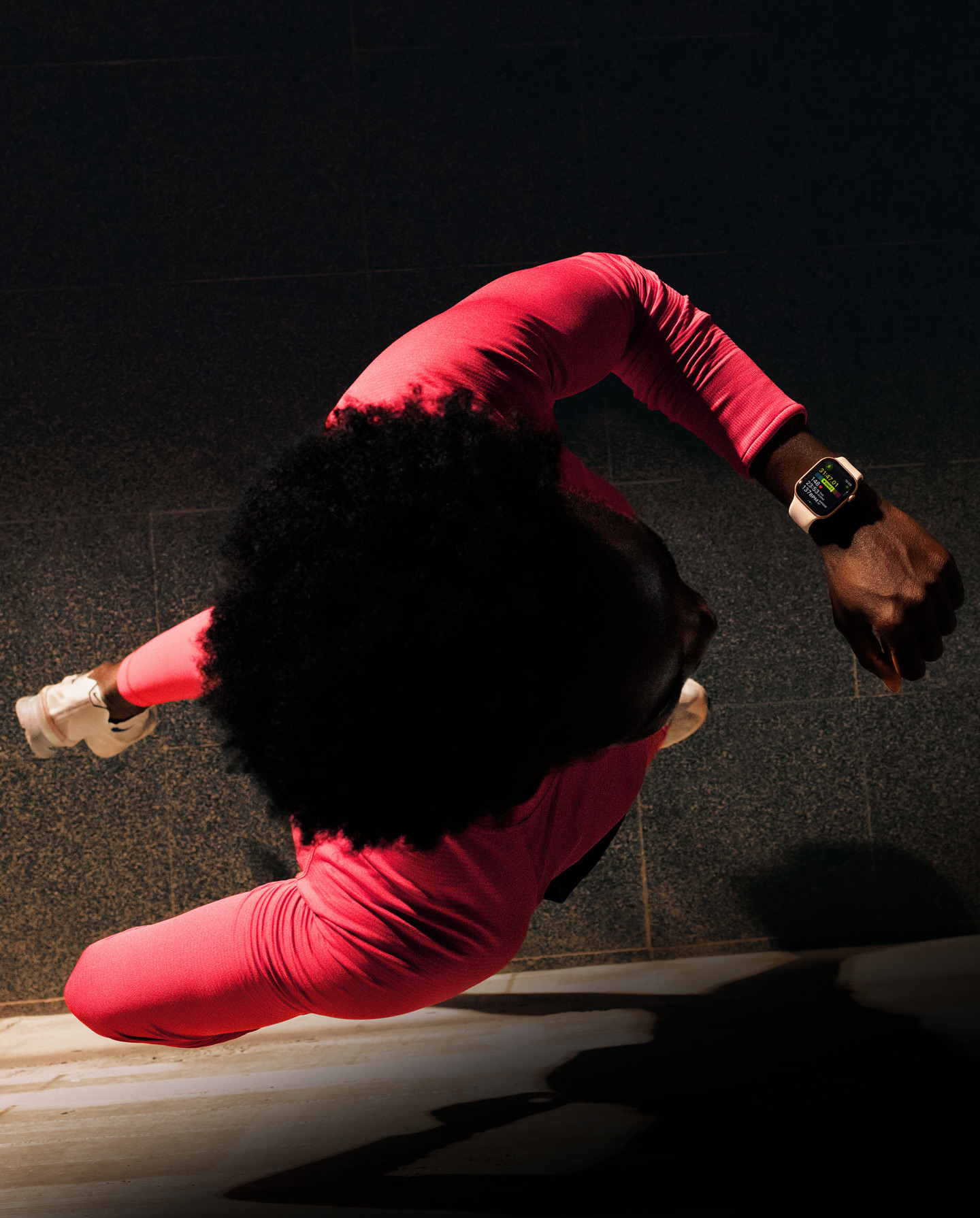 A person checks progress on Apple Watch Series 11 Workout app while running