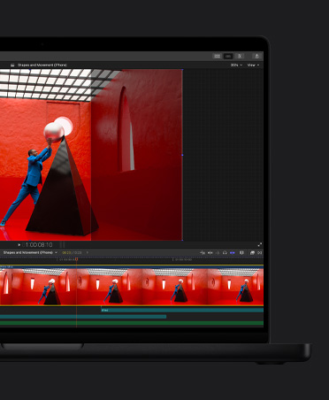 MacBook Pro 16, Video timeline of edit, a man in a blue suit in a red room balancing a giant round pearl atop a black pyramid