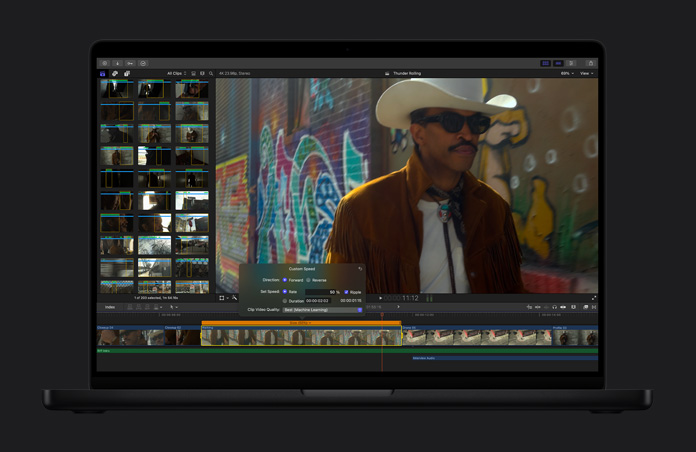 MacBook Pro 16, Demonstration of how a shot can be converted to smooth slow motion, a man in a cowboy hat and sunglasses with graffiti-covered wall in background