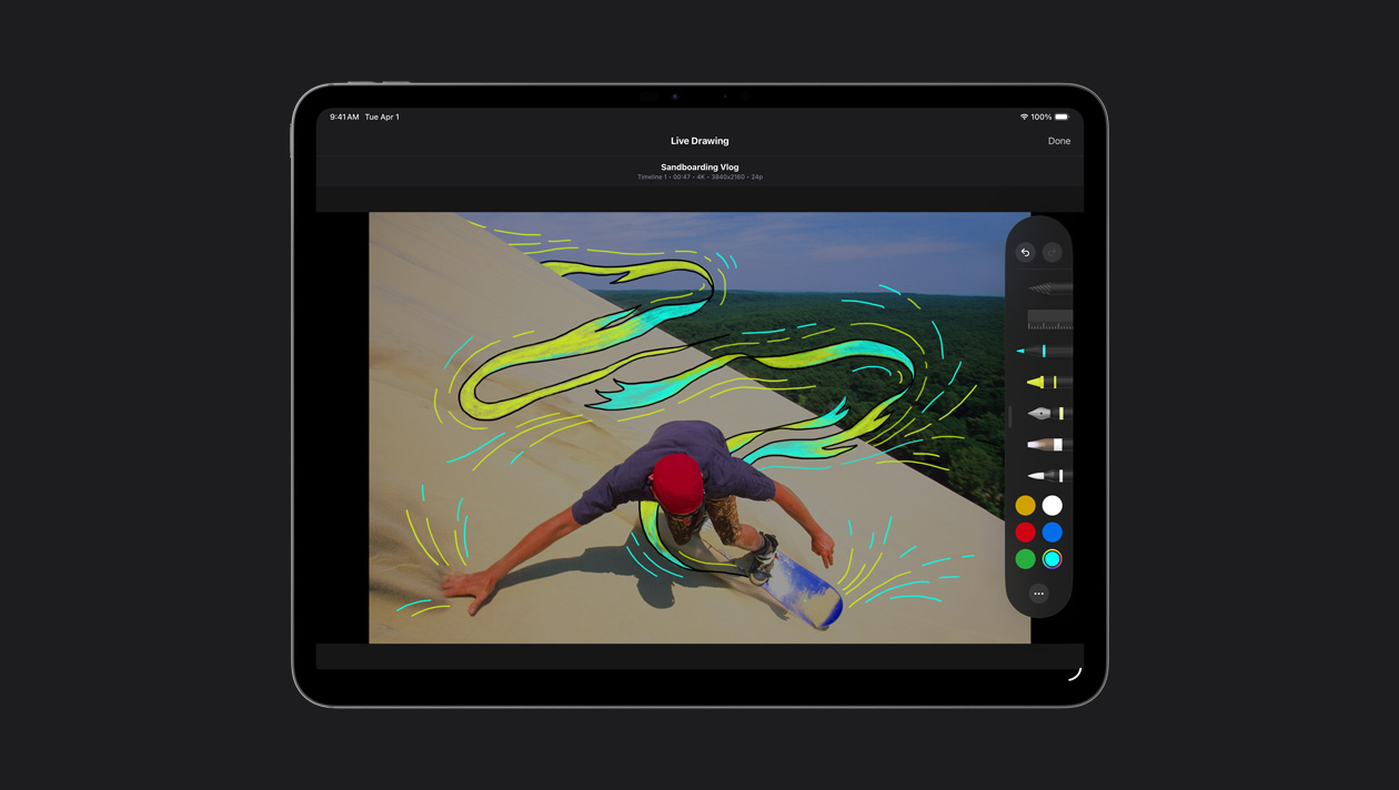 iPad Pro 13, a skater on sand dunes with yellow and blue motion lines around him, demo of Live Drawing
