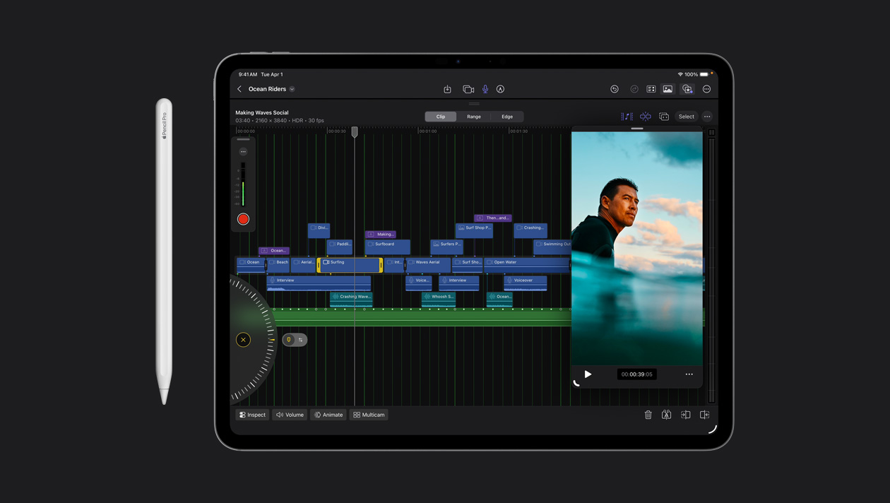 iPad Pro 13 screen showing organized video clips in different colours, image of a surfer in the ocean on the right, Apple Pencil to the left of the device