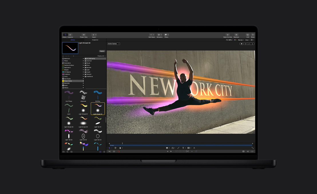 MacBook Pro 16, a male dancer mid-leap with a halo around him, demo of paint tool