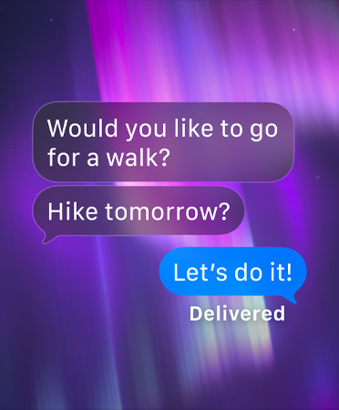 Et billede af nordlys som baggrund for en gruppetråd i Beskeder