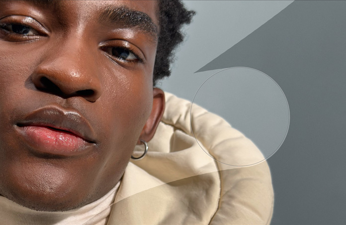 Imagem aproximada do rosto de um homem com as ferramentas de retoque