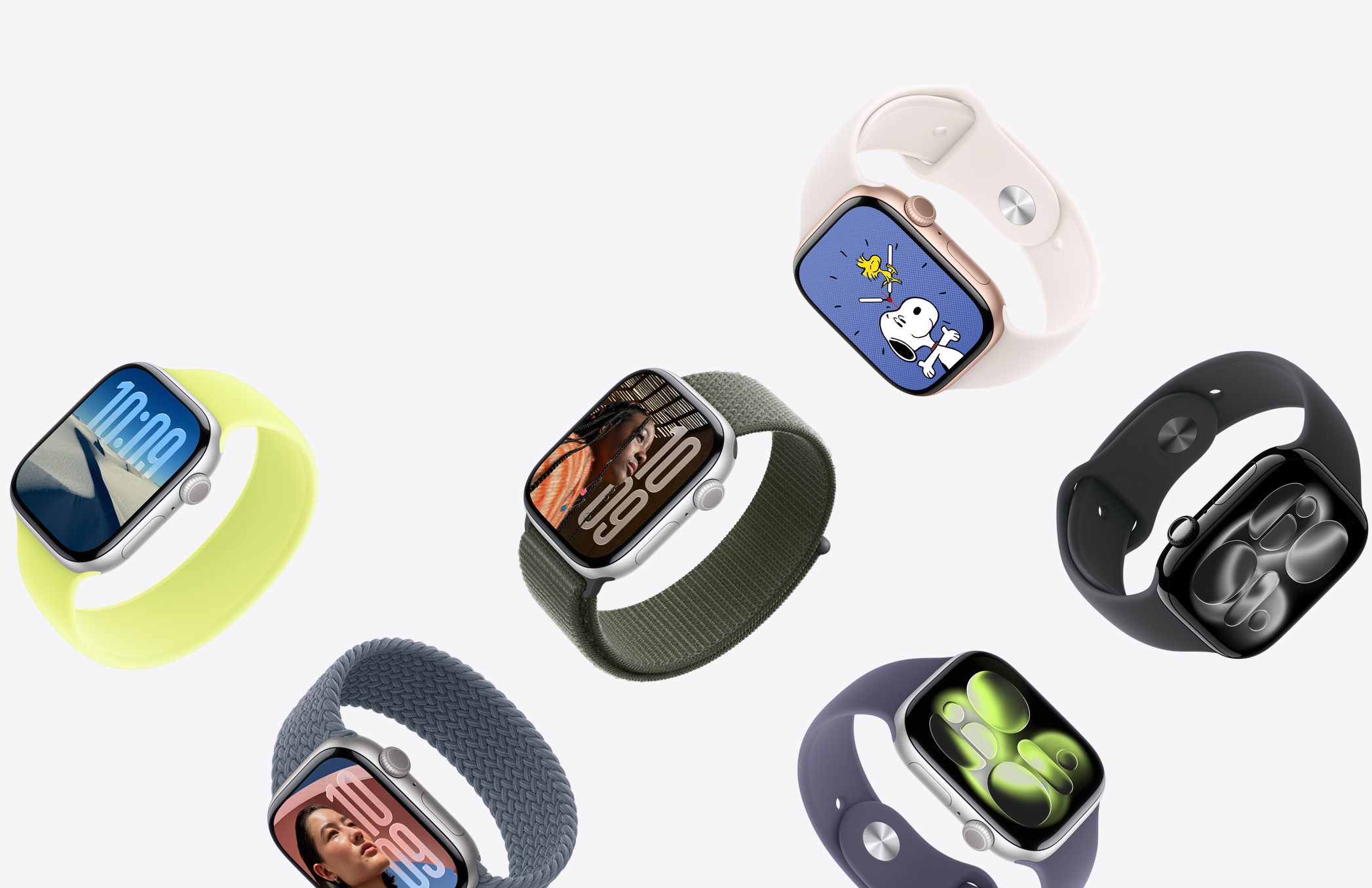 Une sélection d’Apple Watch avec diverses finitions de boîtier et des bracelets de couleurs et matériaux différents.